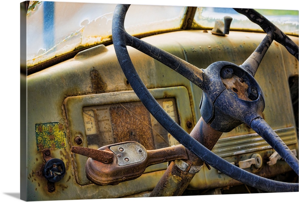 A close up photo of weathered old parts of a vintage truck.