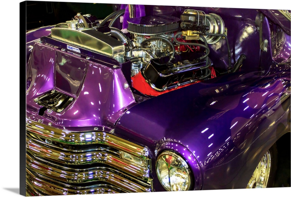 Fine art photograph of a vintage car. The engine is visible and the paint job is a stunning purple.