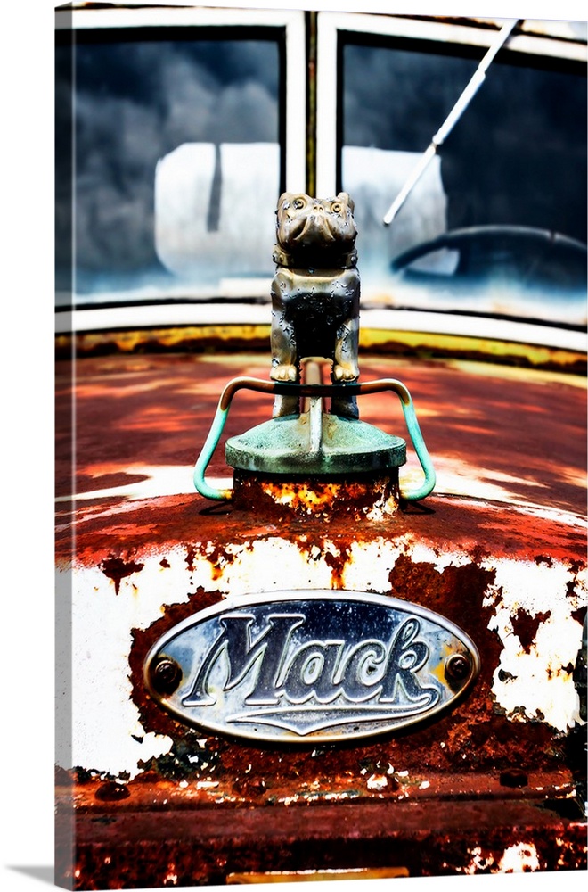 Photograph of the front of an old, rusted Mack truck.