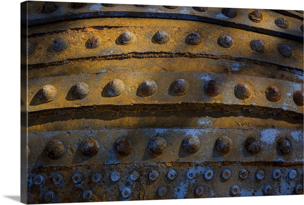 A close up photo of weathered metal elements, creating an abstract image.