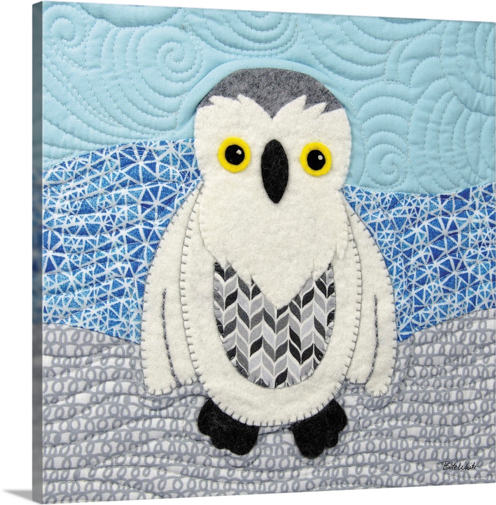 Square sewn art with a snowy white owl on a patterned background.