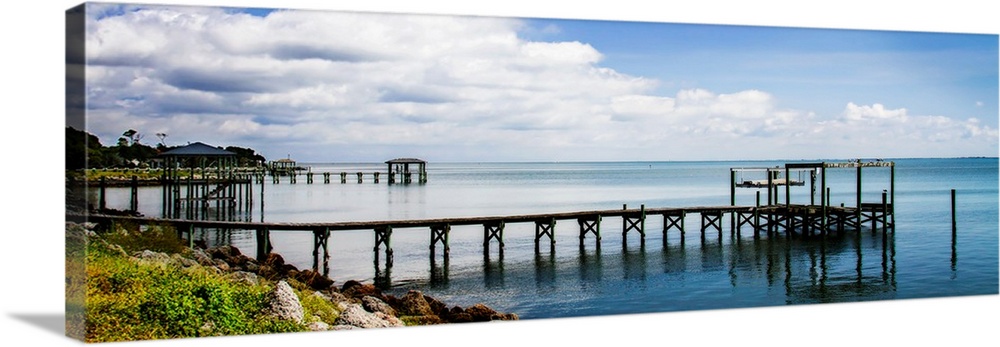 Panoramic photograph of a dock stretched out over the Thorofare Bay in North Carolina.
