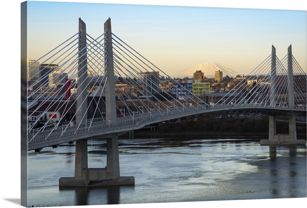 Photograph of Tilikum Crossing Cable Bridge in Portland with the city and  Mount St. Helens in the background.