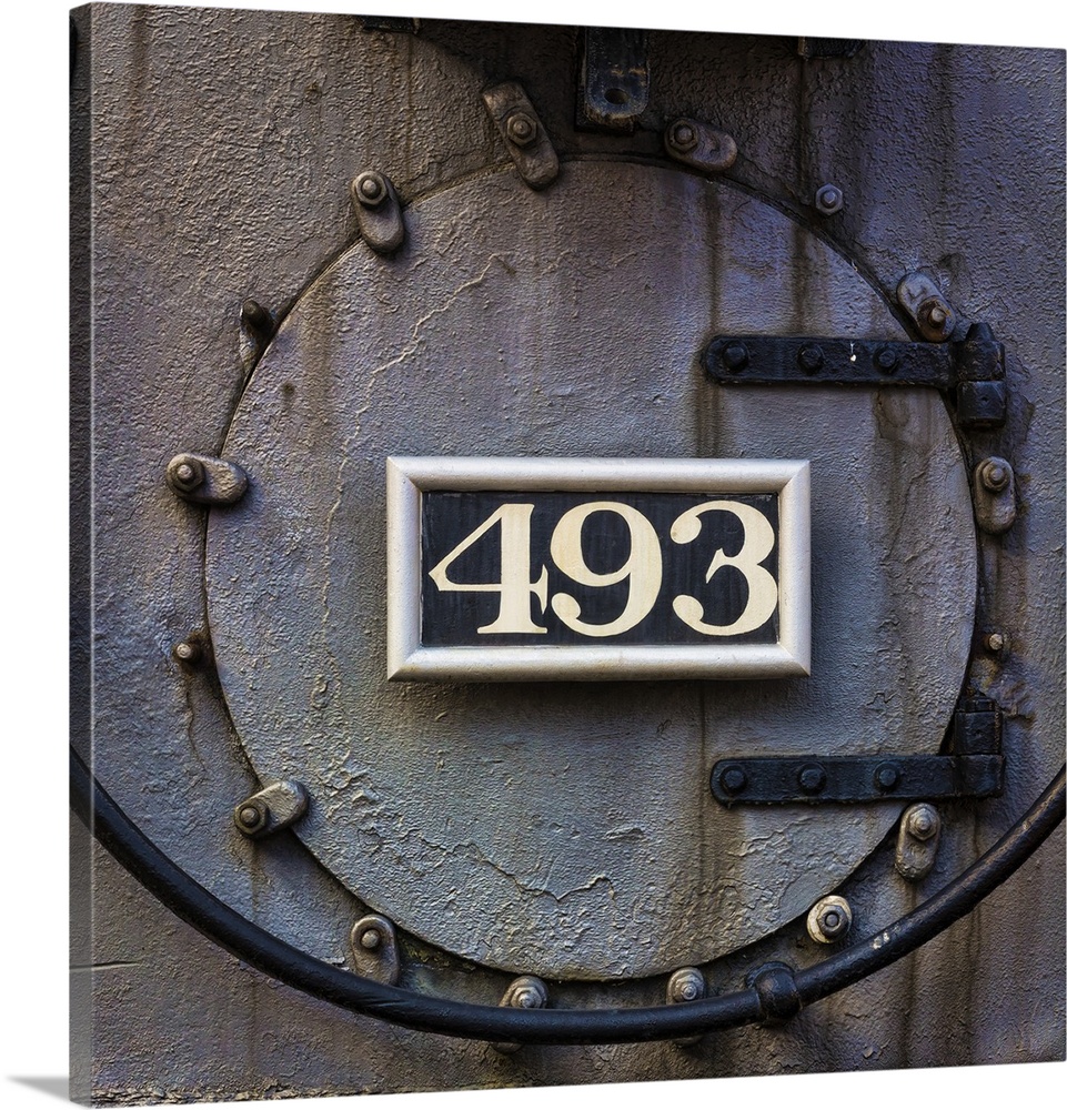 Photograph of weathered detail from a vintage train locomotive.