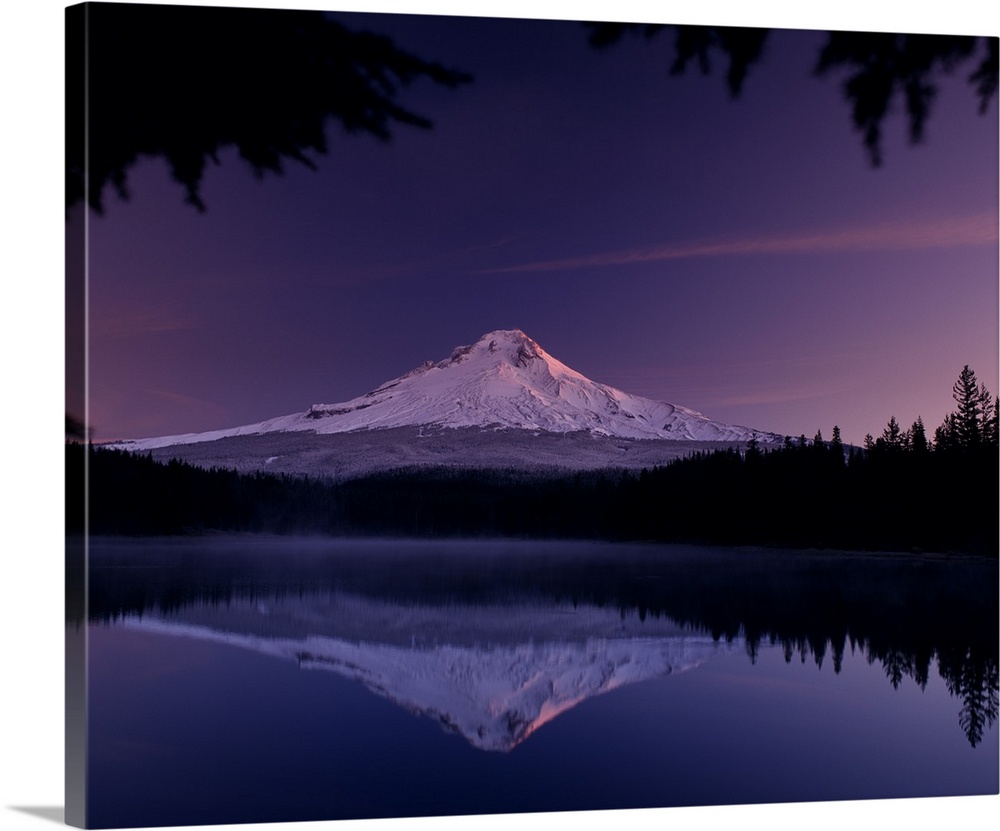 Landscape photograph of Mount Hood reflecting onto Trillium Lake during a purple and pink sunset.