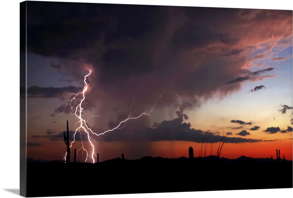 Silhouetted landscape photograph of a desert sunset with dramatic clouds and lightning bolts.