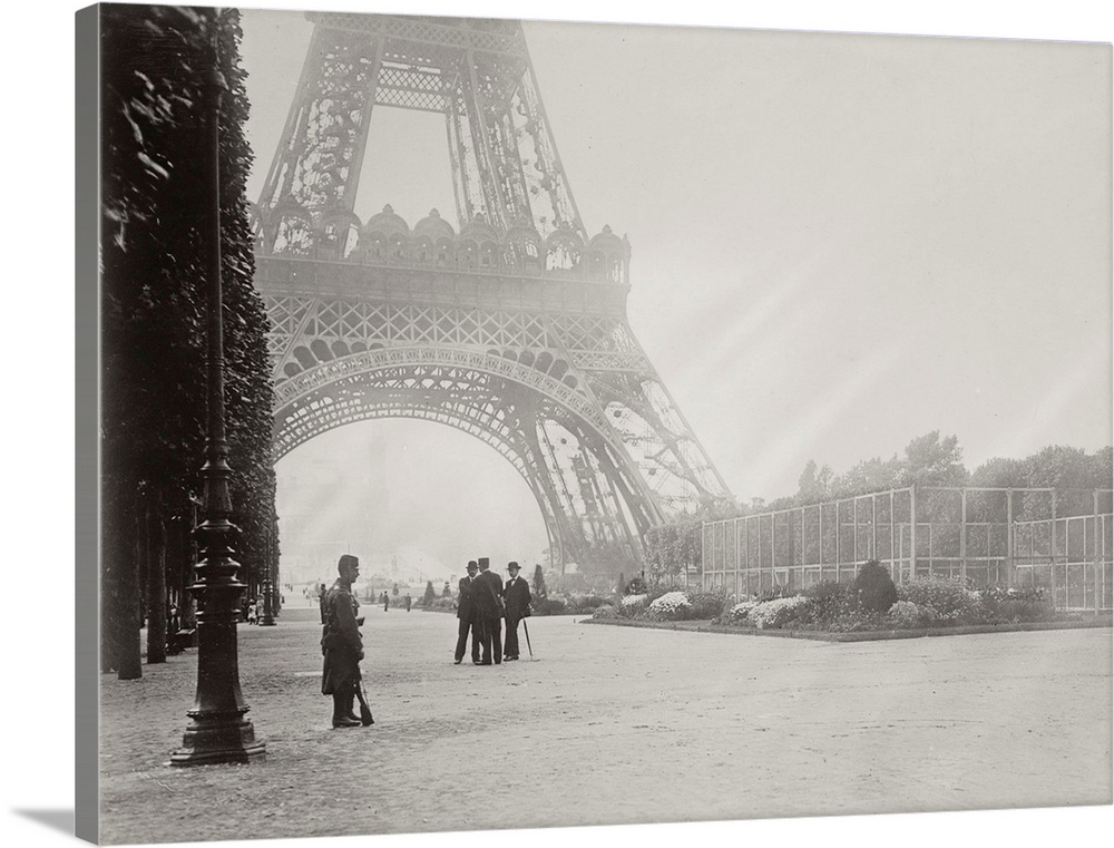 Vintage black and white photograph of Paris in front of the Eiffel Tower on a foggy day.