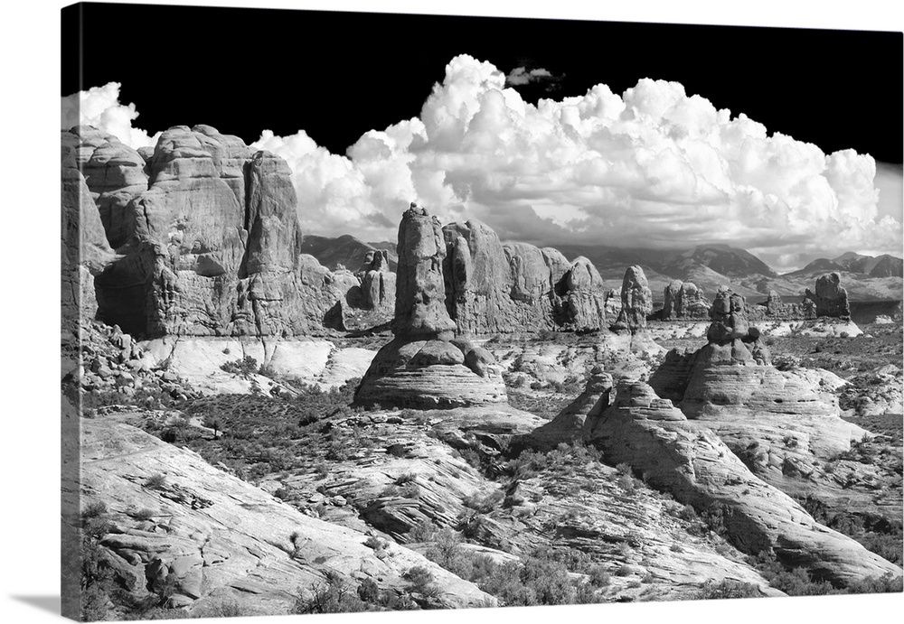 Black and white photograph of sandstone rock formations in the desert.