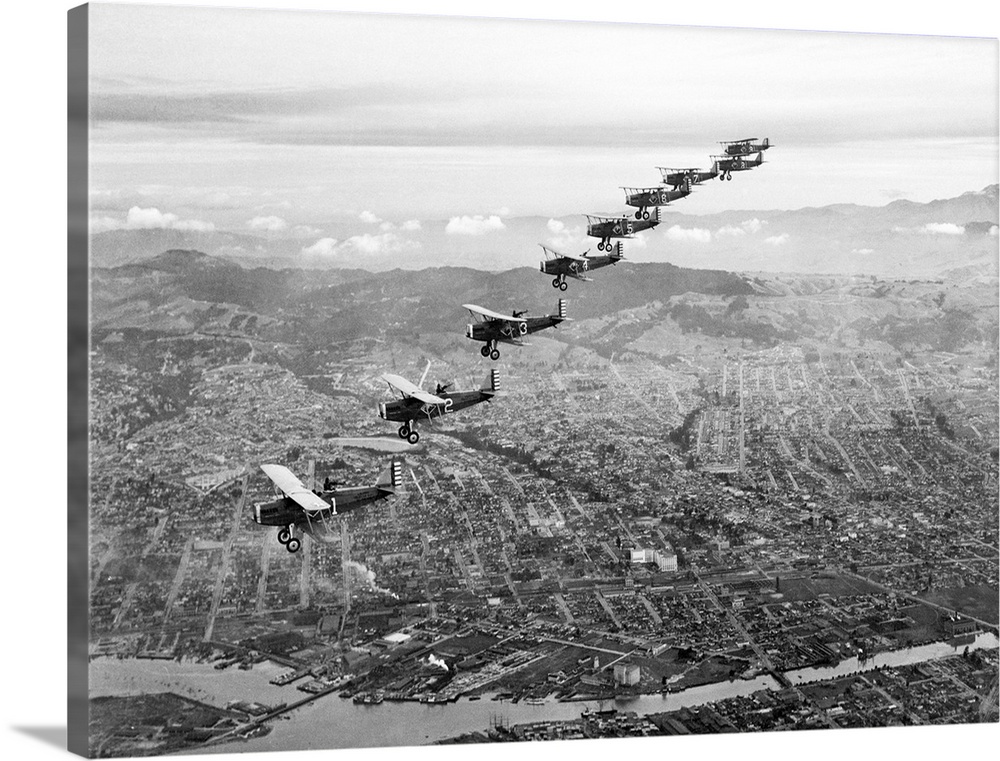 Ready for battle...Nine observation planes from the 91st Observation Squadron of the U.S. Army Air Force flying in perfect...