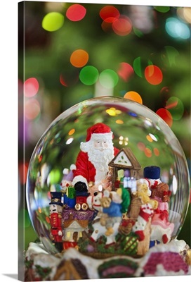 A Christmas Snow Globe With Santa Claus In It