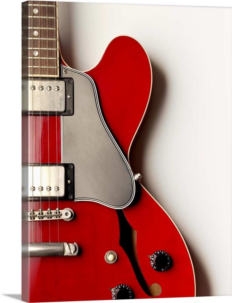 A close up of an electric guitar showing its shape and design.