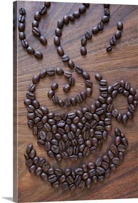 A cup of coffee illustrated using coffee beans