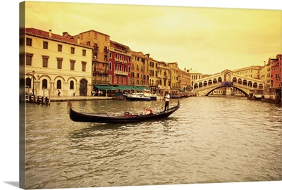 A gondola in a canal, Rialto Bridge, Venice, Italy