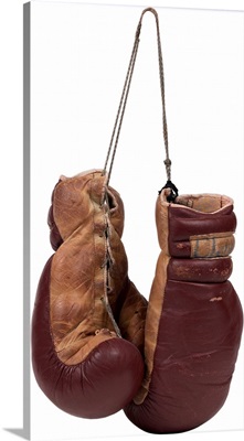A pair of brown leather boxing gloves