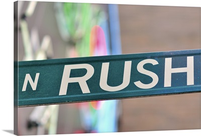 A Rush Street sign in front of a neon sign, Chicago entertainment and night life strip