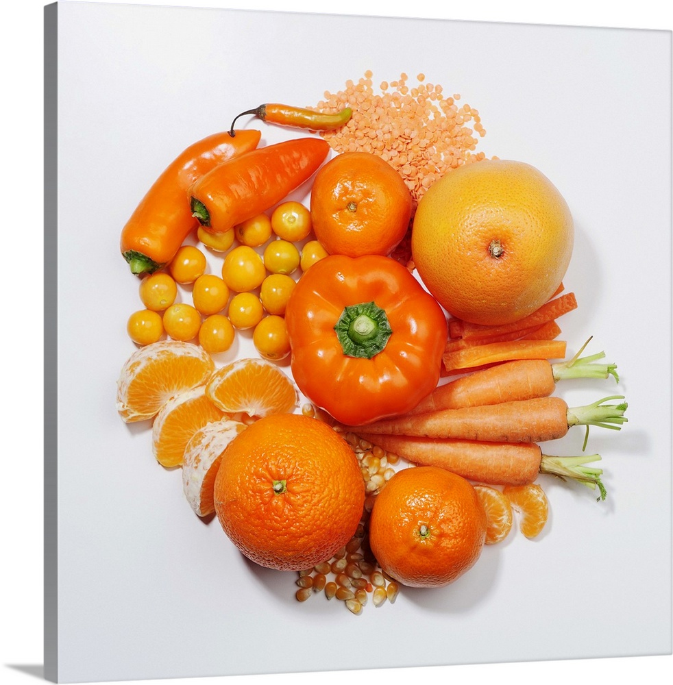 A selection of orange fruits & vegetables.