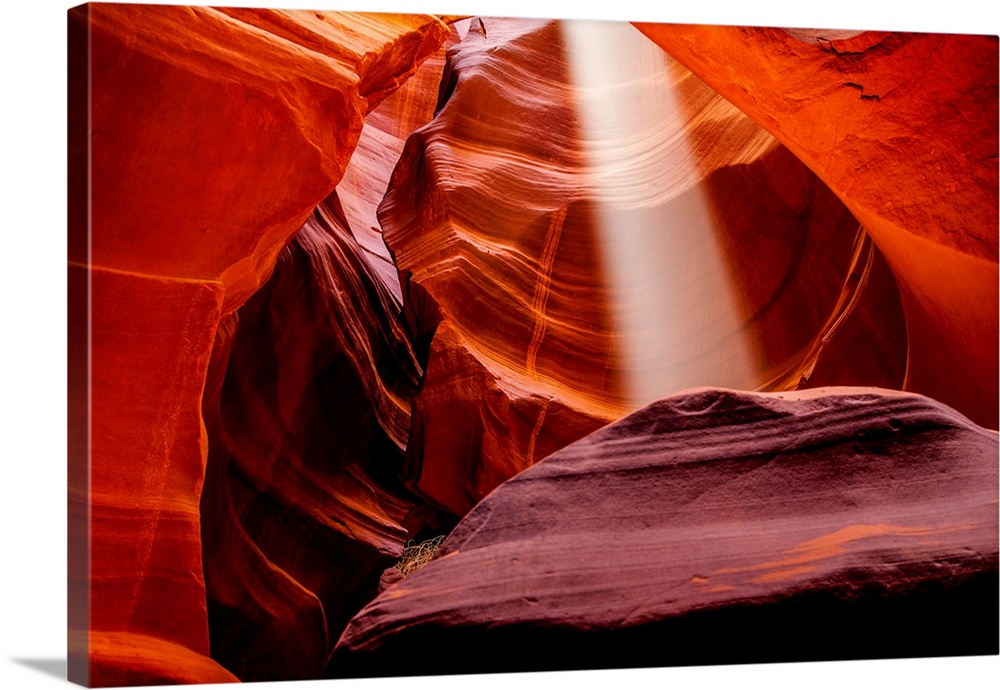 A sunbeam from above pierces through the ceiling of Upper Antelope canyon in Page, Arizona.