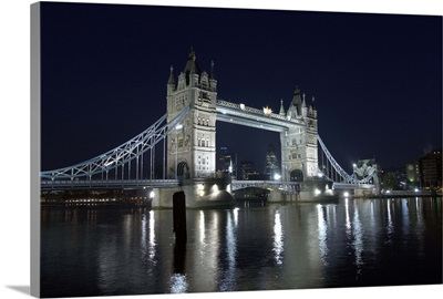 A view across the River Thames to Tower Bridge illumunated at night