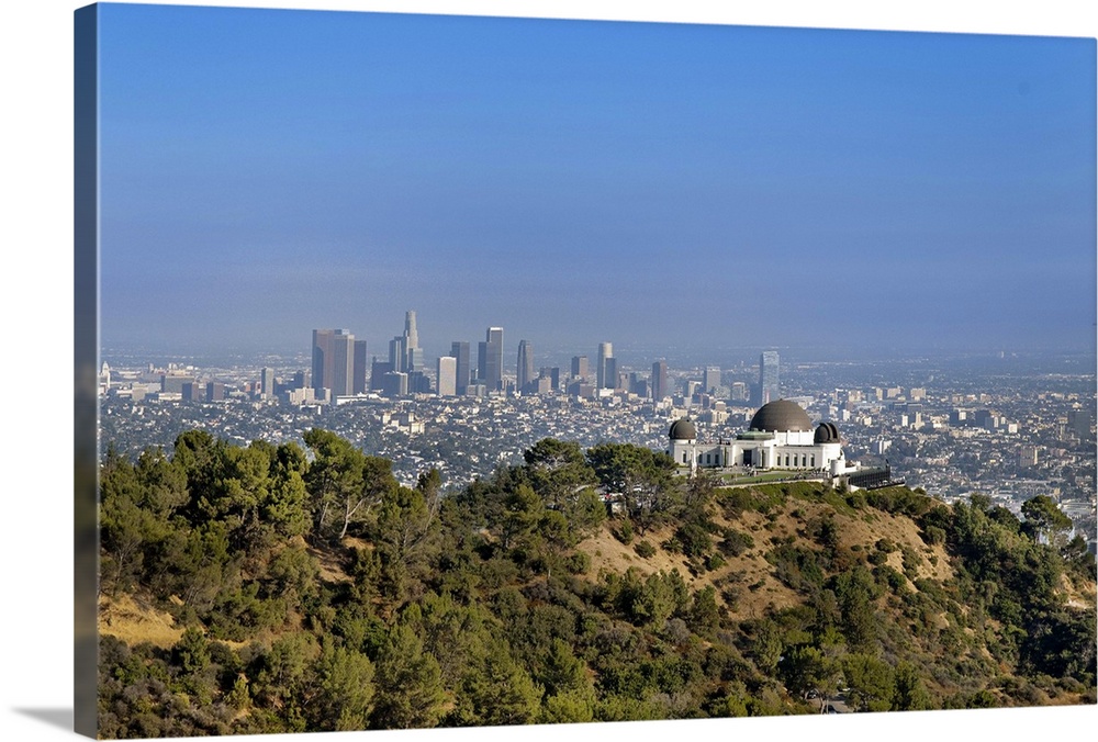 A view from a hiking trail in Griffith Park of the Griffith Park Observatory and downtown Los Angeles.