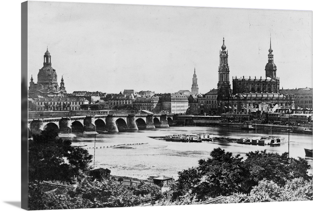 A view of the old Bridge and the surrounding buildings across the Elbe River in Dresden.