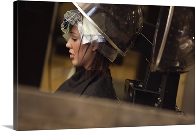 A woman getting her hair done