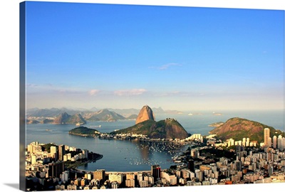 Aerial view of Guanabara Bay with Sugar Loaf Mountain in background.