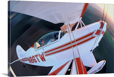 Aerobatic stunt biplane in flight, view from wing