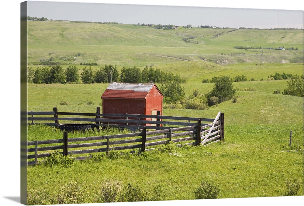 Pasture Fields With A Red Shack And A Fenced Area