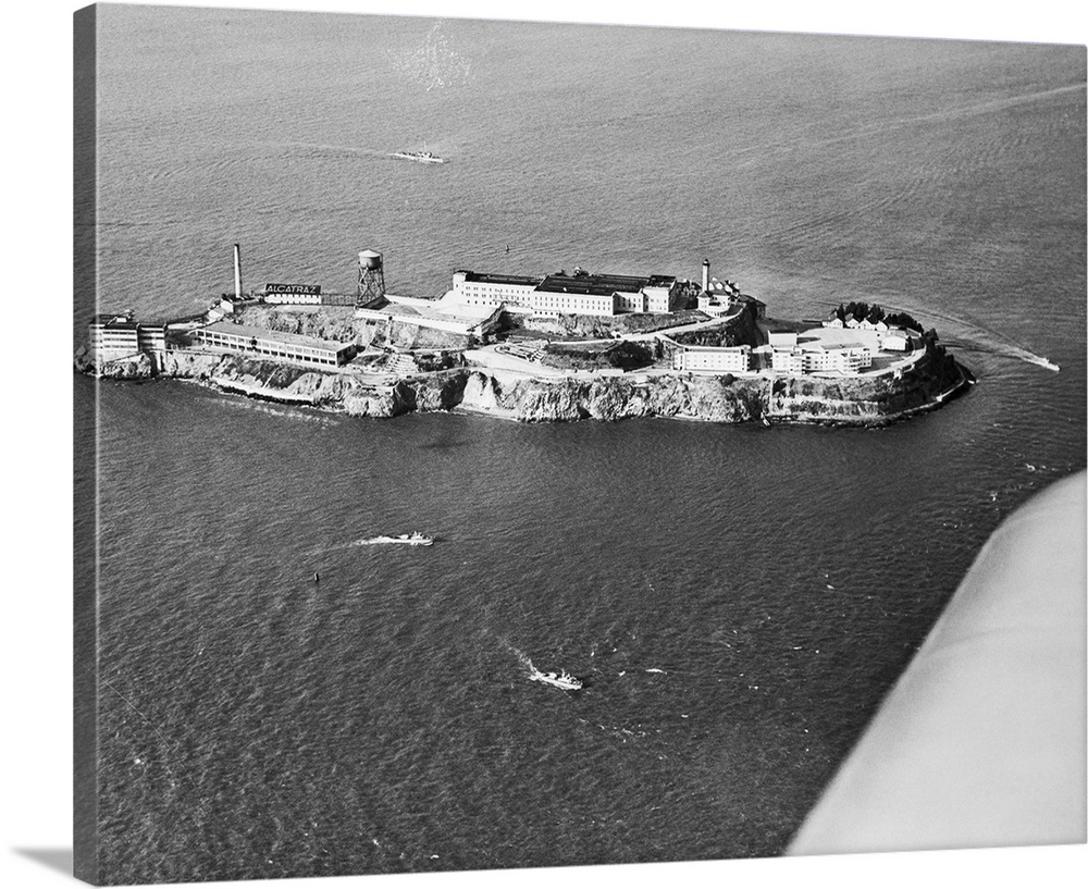 San Francisco police and Coast Guard patrol boats circle Alcatraz Island in response to call from Warden James Johnston as...