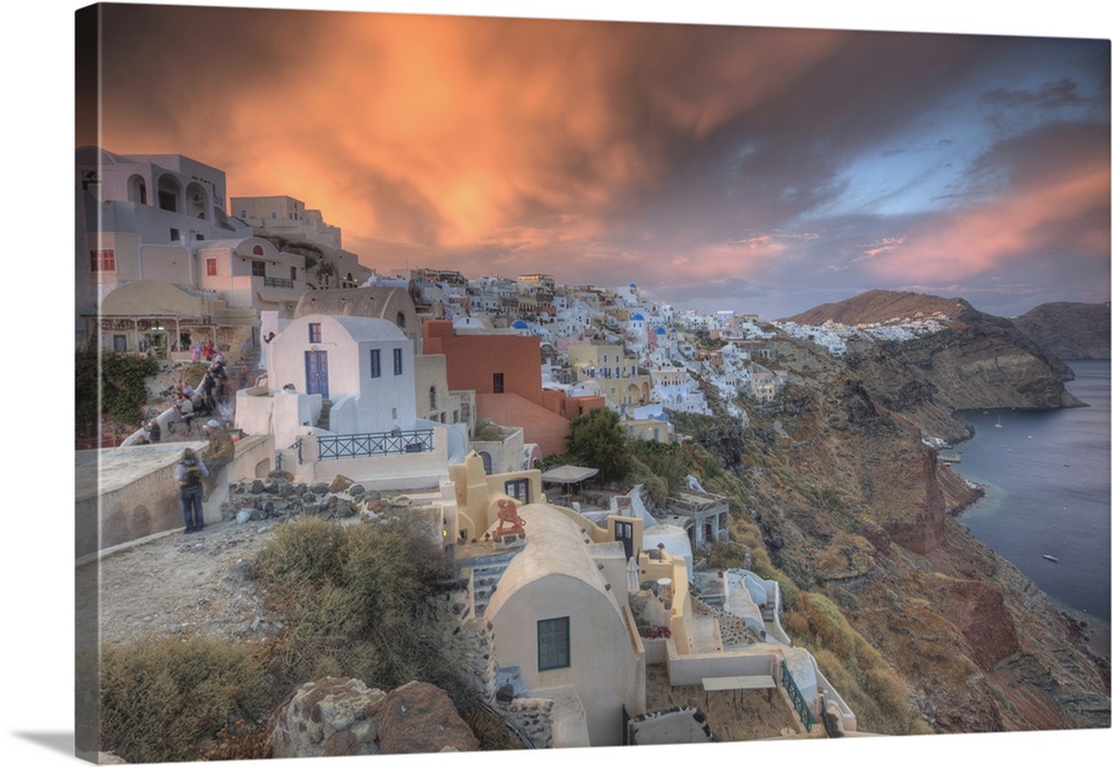 Along the cliff of Oia, houses have been delved into the porous volcanic rock. In the evening hordes of people arrive simp...