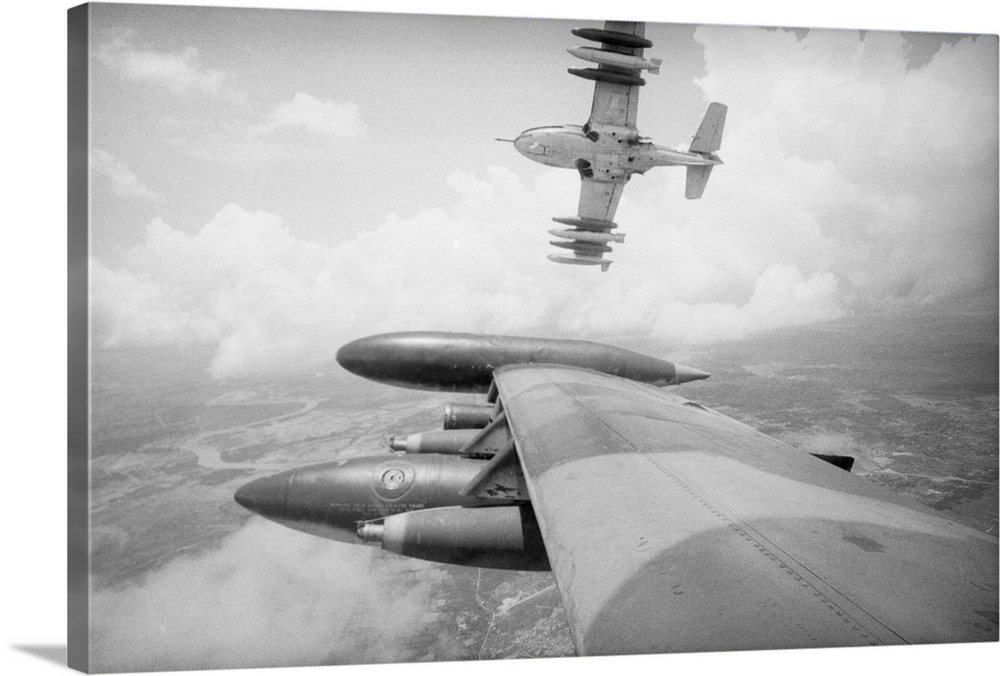 9/1/1972-Over the Mekong Delta, South Vietnam: An American A-37 carrying a deadly payload of Napalm peels off towards its ...