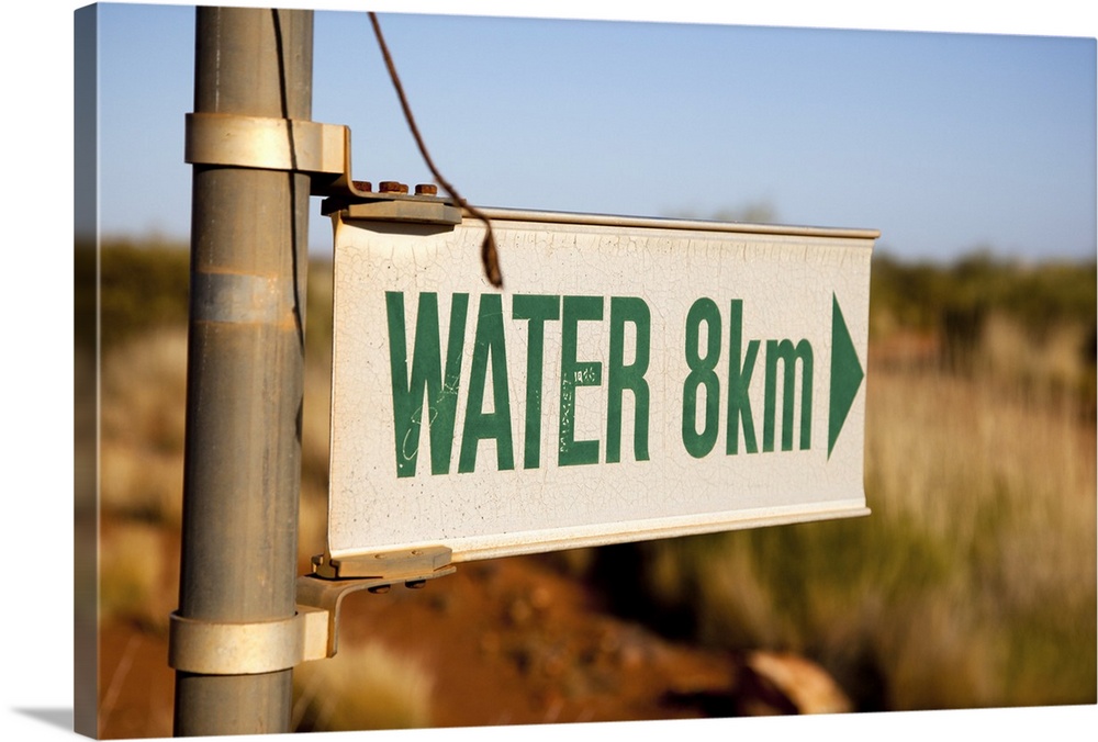 An arrow sign for WATER in 8km