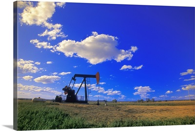 An oil derrick in a field