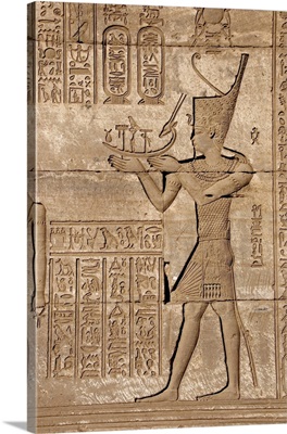 Ancient Egyptian relief depicting man carrying a symbolic bark