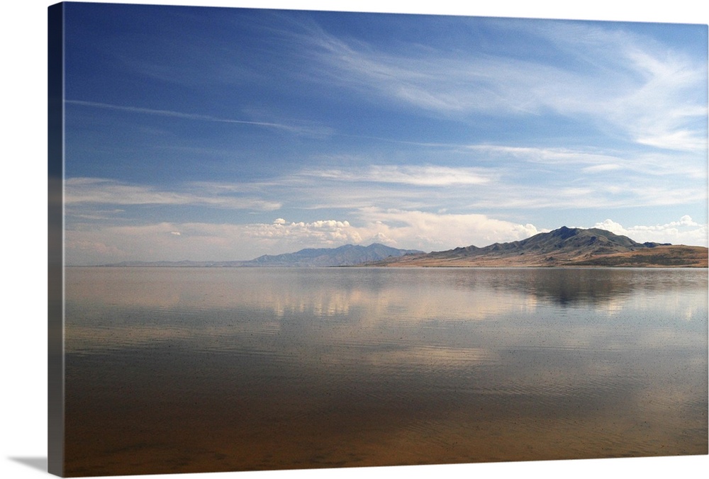 A panoramic view of Antelope Island, reflected in the Great Salt Lake.