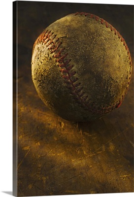 Antique baseball on wooden floor