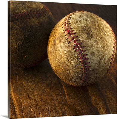 Antique baseballs on wooden floor