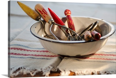 Antique cooking utensils in bowl