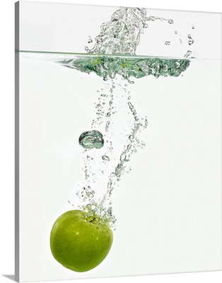 Apple dropping in water