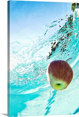 Apple floating in swimming pool