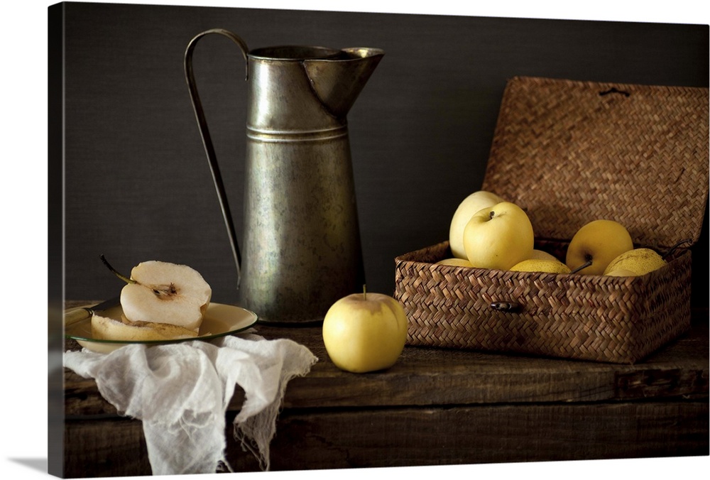 Apples and pears in the basket and dish with kettle.