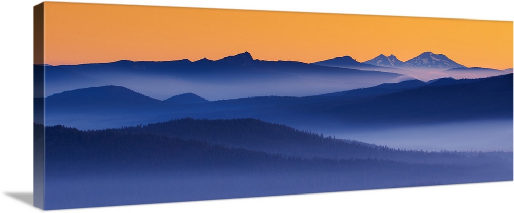 The glowing mist in the predawn hour over the distant Cascade range in Oregon.