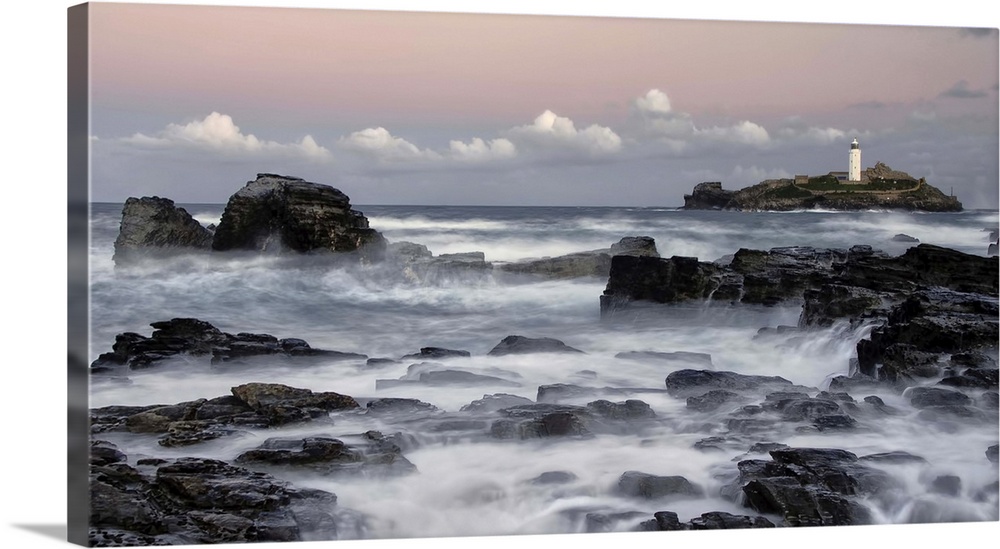 Morning pink skies at sunrise over Godreavy Lighthouse Cornwall