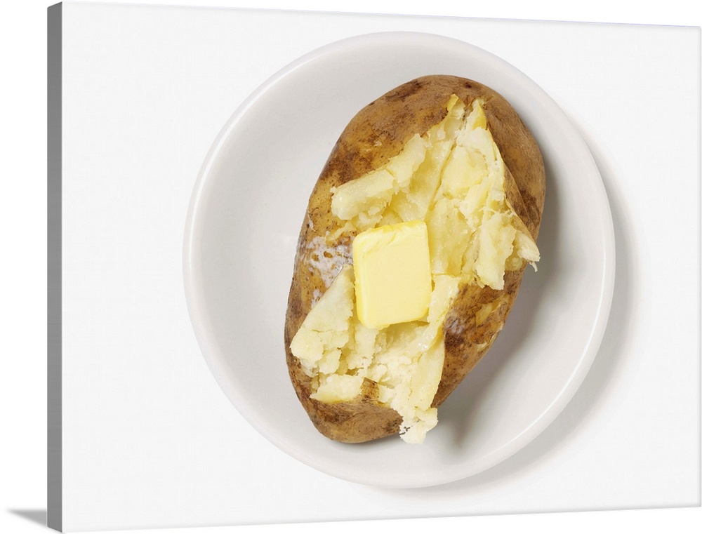 Baked potato sliced open with pat of butter