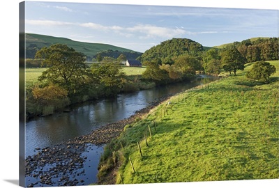Barn in farm land along the River Hodder in The Forest of Bowland, England, UK