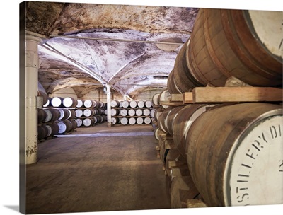 Barrels of whisky aging in distillery