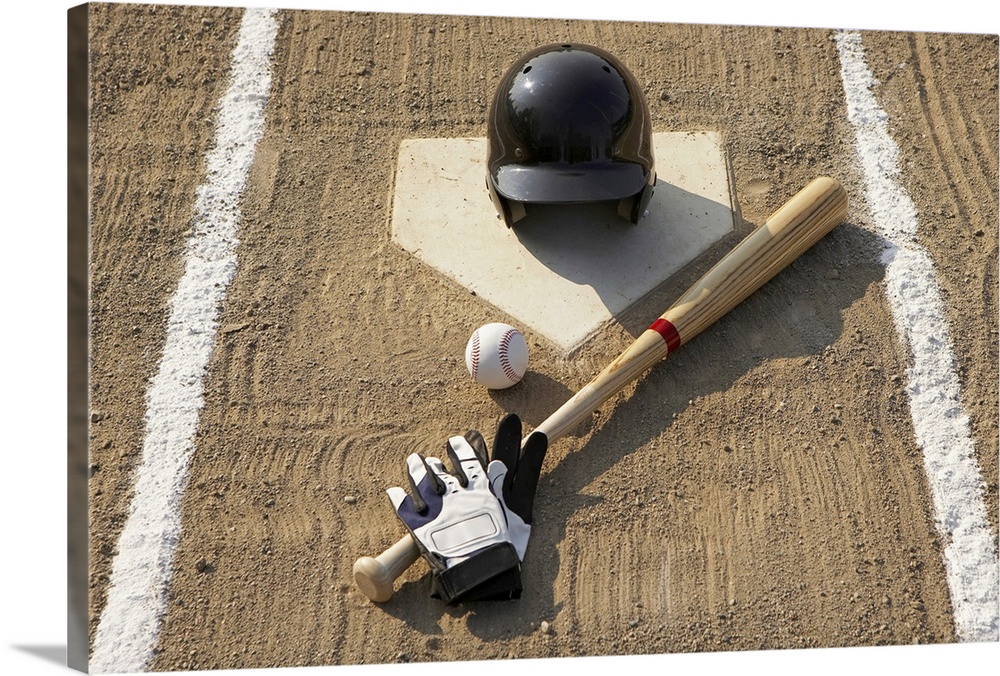 Baseball, bat, batting gloves and baseball helmet at home plate
