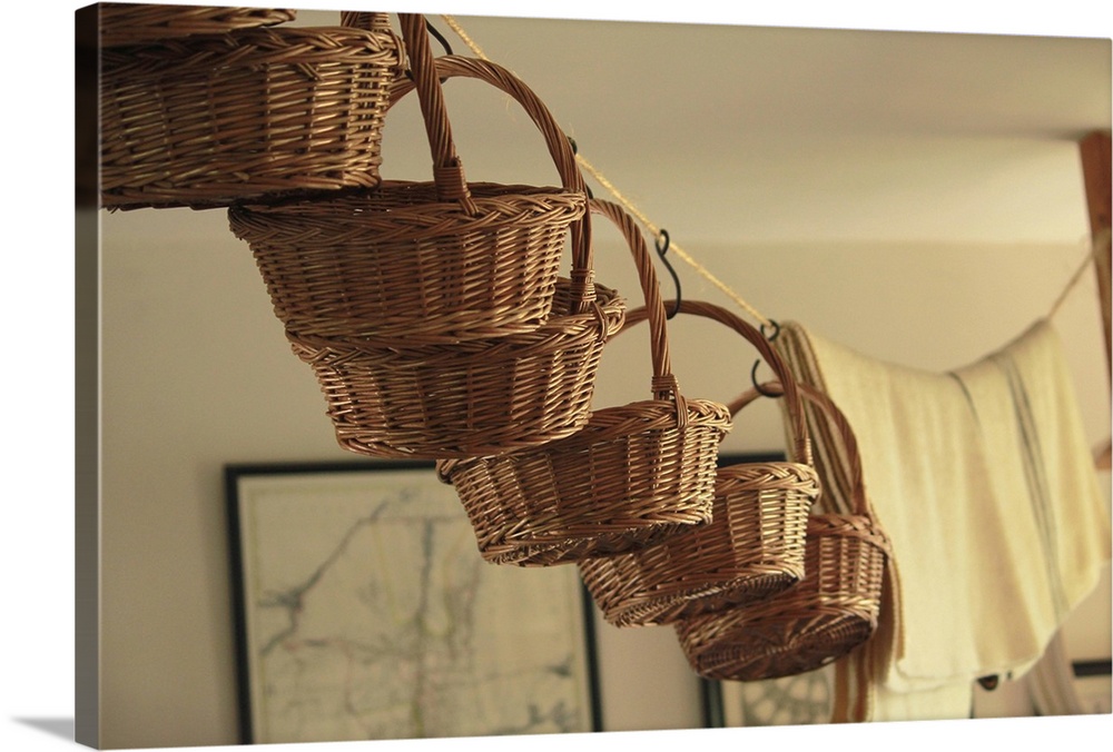 Baskets hanging from washing line.