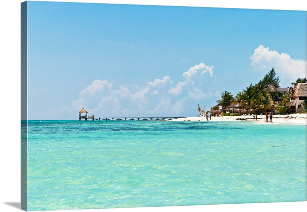 Pier at Playa del Carmen, Mexico.Blue water, wjite sand, palm trees and peace.