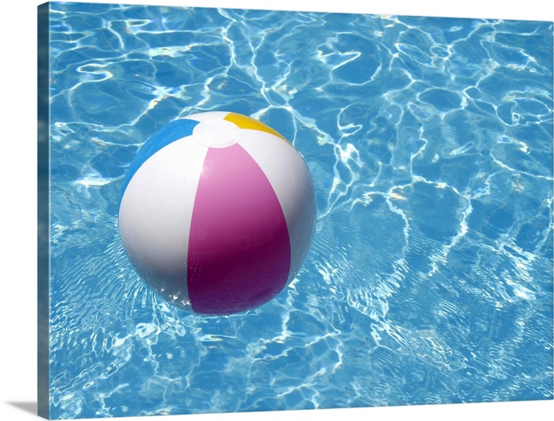 Beach ball in swimming pool the picture of summer holidays. | Great Big